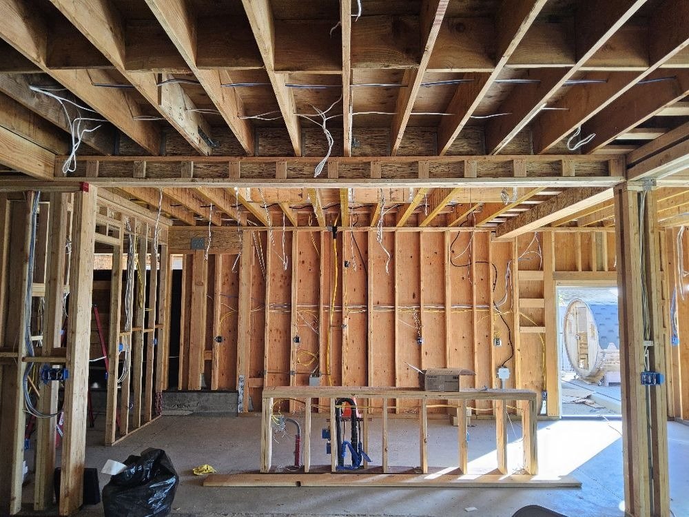 Wood framing and wiring in house under construction
