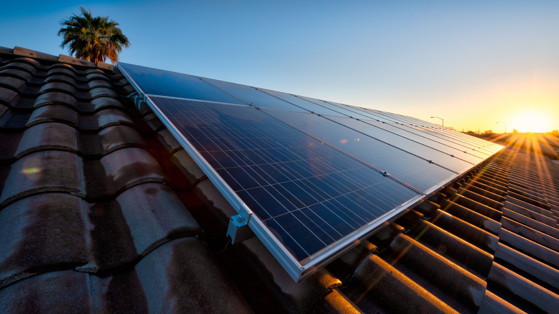 Solar panels on roof at sunset